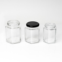 Vente en gros Pot de confiture Pot de miel 45ml 100ml 180ml 280ml 380ml 500ml 730ml Bouteille hexagonale en verre Pot alimentaire