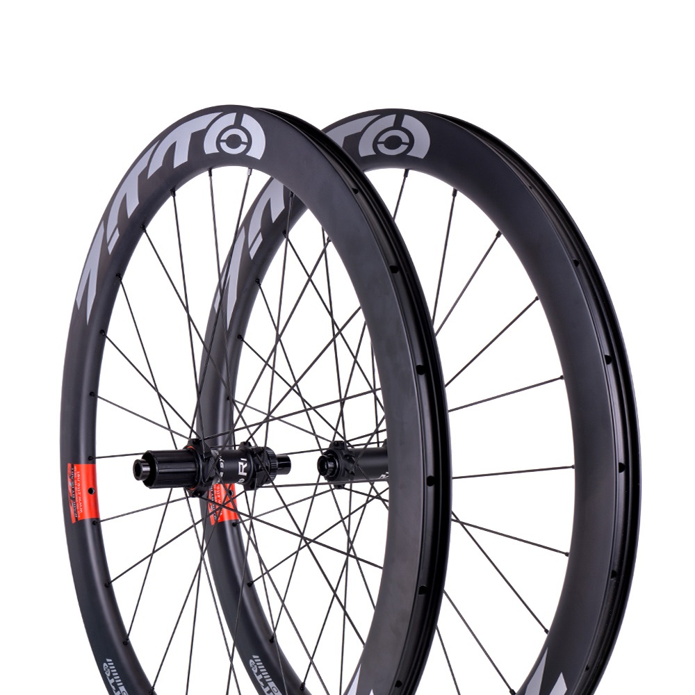 ZTTO सड़क बाइक कार्बन फाइबर Tubeless डिस्क ब्रेक Wheelset 38mm 45mm 50mm एयरो रिम 142 के माध्यम से धुरा 6 Pawls हब R1 साइकिल पहिया