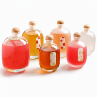 Bouteille à spiritueux ovale en verre borosilicate, forme galet, luxe unique, pour gin et whisky, base lourde avec sérigraphie intégrée
