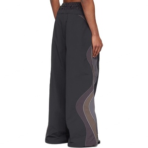 กางเกงวอร์มขาบานทรงหลวมขนาดใหญ่พิเศษ ผ้าไนลอน แต่งแถบลายทาง สไตล์ลำลอง สำหรับผู้ชาย - Product Image 4