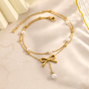 Nouvelle collection de bijoux d'été : Bracelet de cheville double couche en acier inoxydable plaqué or PVD, avec breloque perle délicate et nœud, étanche, vente en gros - Product Image 4