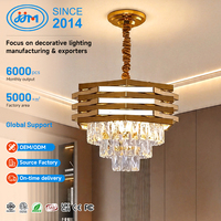 Lustre suspendu LED de luxe postmoderne en acier inoxydable pour hôtel, salle de banquet, club, escalier, avec cristaux