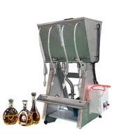 Machine de remplissage liquide à petite gravité commerciale 4 têtes Machines de remplissage d'embouteillage de bouteilles de vin whisky liqueur