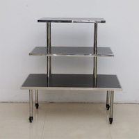 Table de présentation roulante en acier inoxydable sur mesure à 3 niveaux, présentoir de vente au détail pour chaussures, sacs, bijoux, vente directe d'usine