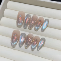 10 faux ongles press-on faits main, forme amande, style français, effet sirène œil de chat, avec perles brillantes, strass et dégradé bleu scintillant