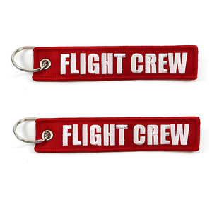 Venta al por mayor barato personalizado marca mover vuelo coche logotipo tela clave etiqueta bordado llavero - Product Image 5