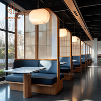Ensemble de banquettes de restaurant commercial modernes et élégantes, bleu marine, avec rembourrage doux en tissu, structure en bois et table à manger en marbre