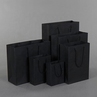 Vente en gros d'usine de sacs à provisions cadeaux en papier kraft noir enduit de bonne qualité avec logo personnalisé pour bougie