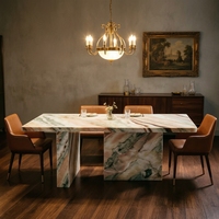 Table à manger portable 6 places en marbre onyx coloré, design moderne et vibrant, avec plateau rond et pieds inclinés, pour la maison et les halls d'hôtels de luxe