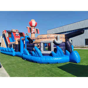 Château gonflable combiné avec parcours d'obstacles sur le thème du bateau pirate, double toboggan, PVC de qualité commerciale, capacité de 500 kg, mur d'escalade - Product Image 1