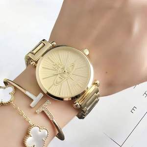 Nuevos relojes de pulsera de China con caja redonda dorada, diseño de Saturno, esfera con efecto rayos de sol, brazalete de metal, relojes de lujo para mujer. - Product Image 6