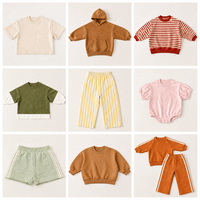 T-shirt décontracté en coton épais à manches courtes et col rond pour tout-petits, coupe ample avec ourlet fendu et épaules tombantes, style oversize baggy, fabrication OEM