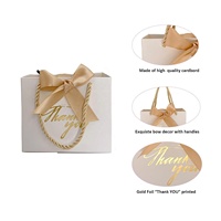 Petits sacs-cadeaux portables de luxe or et blanc avec ruban pour bijoux montres cosmétiques vêtements pour mariages merci impressions