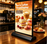 Boîtes lumineuses publicitaires LED pour comptoirs commerciaux avec cadre noir et base robuste pour l'affichage des menus de restaurants et cafés