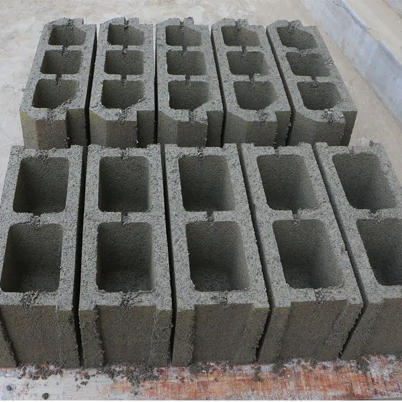 small cheap manual concrete hollow hourdis block brick making machinery