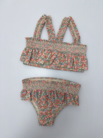 Vente en gros de bikinis européens pour enfants, maillots de bain une pièce d'été pour filles, vêtements de plage, costume de princesse UV à volants imprimé avec chapeau, 2025