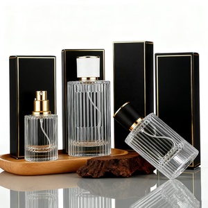 Venta Caliente de Botellas de Perfume de Vidrio Cilíndricas de 30ml 50ml 100ml con Pulverizador, Cabezas de Bomba y <span class=keywords><strong>Tapas.</strong></span> Logotipos Impresos en Serigrafía Personalizados. Embalaje Exterior - Product Image 1