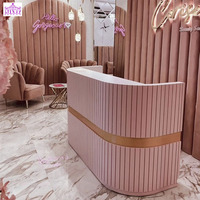 Meilleures ventes Bureau de réception rose adorable personnalisé Comptoir de salon de beauté Petite table de réception Bureau de réception circulaire pour salon de manucure