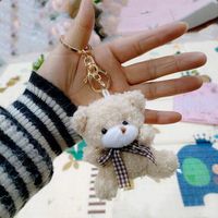 Nouveau mignon Mini ours en peluche porte-clés pendentif doux en peluche jouet noeud papillon Super doux Nylon matériel PP coton rempli peluche poupée