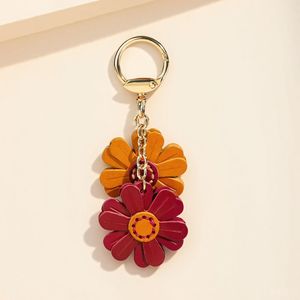 Custom Hot Selling flower <b>keychain</b> fashion Bag Charms Genuine pu <b>Leather</b> Metal <b>Keychain</b> Gifts - Product Image 4