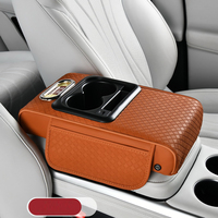 Meilleure Vente : Coussin d'accoudoir de voiture multifonctionnel de luxe avec fonction de charge, porte-gobelet, boîte de rangement et rehausseur en cuir