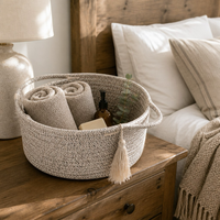 Panier cadeau rond en corde de coton tressée style ferme avec poignées en chevron et pompon pour la maison - Vente en gros