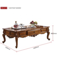 Table basse en bois antique de luxe avec pieds sculptés pour salon