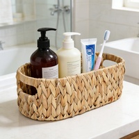 Panier de rangement ovale tressé à la main en jacinthe d'eau nordique Girida, écologique et polyvalent, avec couvercle et poignée, pour bureau et table basse