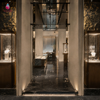 Sundo, boutique de bijoux et de montres de luxe, mobilier avec vitrine d'îlot sur mesure et présentoirs muraux pour clients haut de gamme