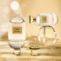 Flacon de parfum rond transparent de luxe de haute qualité 100 ml avec bouchon à vis personnalisé en verre rechargeable avec étiquette