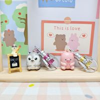 24-teiliges Plastik-Kinderspielzeug-Set 9cm Roboter-Handgreifer & 6cm Quetschbare Puppe Cartoon-Figur Schlüsselanhänger für Partygeschenke und Schulpreise