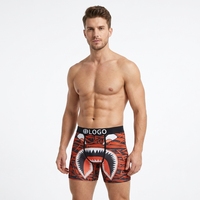 Sous-vêtements pour hommes ODM en polyester à séchage rapide, à taille mi-haute, effet push-up, avec logo imprimé tricoté à la taille et motif géométrique, style pantalon de survêtement