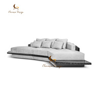 Canapé modulaire en cuir moderne de luxe avec base large et unique, idéal pour les grandes maisons, les hôtels et les salons.