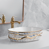 Lavabo de salle de bain en céramique de luxe de forme ovale, design artisanal, finition électrolytique multicolore, lavabo de table