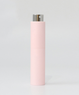 Botella de perfume rosa claro