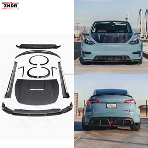 ชุดแต่งคาร์บอนไฟเบอร์สไตล์ CMST สำหรับ Tesla Model Y แบบติดตั้งเอง ประกอบด้วยลิ้นหน้า สเกิร์ตข้าง ดิฟฟิวเซอร์ สปอยเลอร์ และฝากระโปรง - Product Image 1