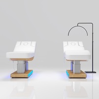 Table de massage électrique à 4 moteurs avec éclairage LED, colonne en acier inoxydable et base en bois, pour salon de tatouage et spa – Vente en gros usine
