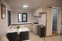 Casa Contenedor Portátil Expandible de Doble Ala Plegable con Sistema Solar