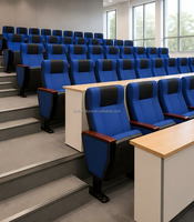 Sièges d'auditorium architecturaux en tissu bleu avec tablette intégrée à grain de bois et base stable pour grand théâtre