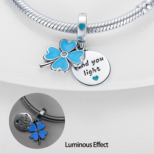 This white brass <b>bracelet</b> features enamel <b>flowers</b> and stars, glows in the dark, and its cute style makes it a perfect gift - Product Image 2