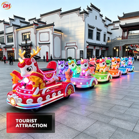 Train électrique personnalisable sans rails pour enfants, thème licorne de dessin animé, avec lumières dynamiques et musique, idéal pour les marchés nocturnes et les projets d'investissement
