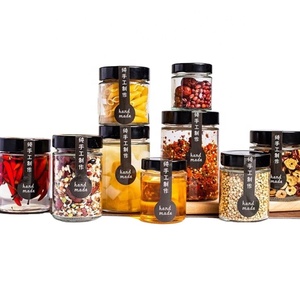 Vente en gros de pots en verre ronds transparents vides de qualité alimentaire, mini pots à confiture, pots à miel, petits pots en verre avec couvercle en métal noir - Product Image 1