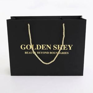 ถุงกระดาษของขวัญสำหรับร้านค้าปลีกเสื้อผ้าหรูหรา พิมพ์โลโก้แบรนด์ตามสั่ง ขายส่ง พร้อมหูหิ้วริบบิ้น - Product Image 3