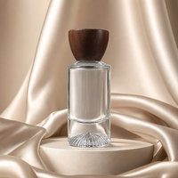 Flacon de parfum vide en verre transparent rond de qualité supérieure OEM ODM avec fond épais et bouchon en bois, logo personnalisé
