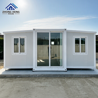 Casa Modular Expandible de Acero con Estructura en I, Acabado Gris Claro con Detalles Blancos, Puerta Corredera, Prefabricada, Reubicable, Almacén Listo para Usar, Hogar Moderno
