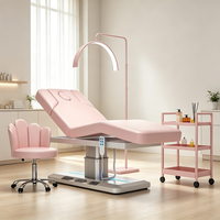 Table de massage électrique rose réglable pour spa avec trou facial et lumière LED, idéale pour salon de beauté (OEM)