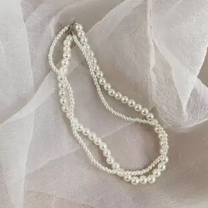 Caliente 2024 joyería de moda collares retro de perlas de doble capa en capas
