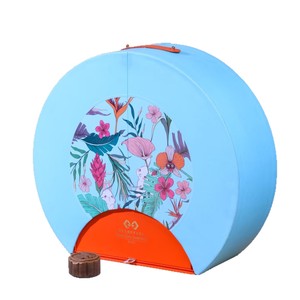 Caja de Regalo para Perfume, Diseño Redondo con Patrón Floral, Tapa Azul y Naranja, Empaque de Lujo para Set de Regalo, Marca Xian Hotel - Product Image 1