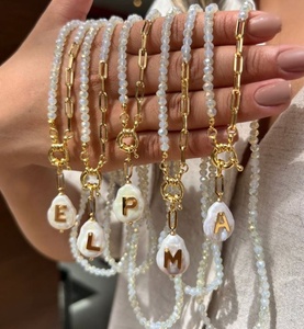 ชุดสร้อยคอและกำไลข้อมือประดับมุกน้ำจืดหินธรรมชาติ ดีไซน์ใหม่ รูปตัวอักษร ประดับลูกปัดแบบซ้อน ชุบทอง 18K เครื่องประดับหรูหราสำหรับทุกเพศ - Product Image 6