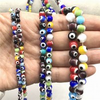 Vente en gros de perles de verre turques à triple œil maléfique en cristal pour la fabrication de bijoux et décoration de la maison